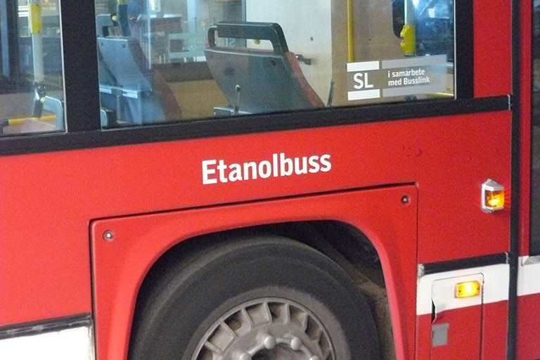 Label on the side of a bus reading “etanolbuss.”