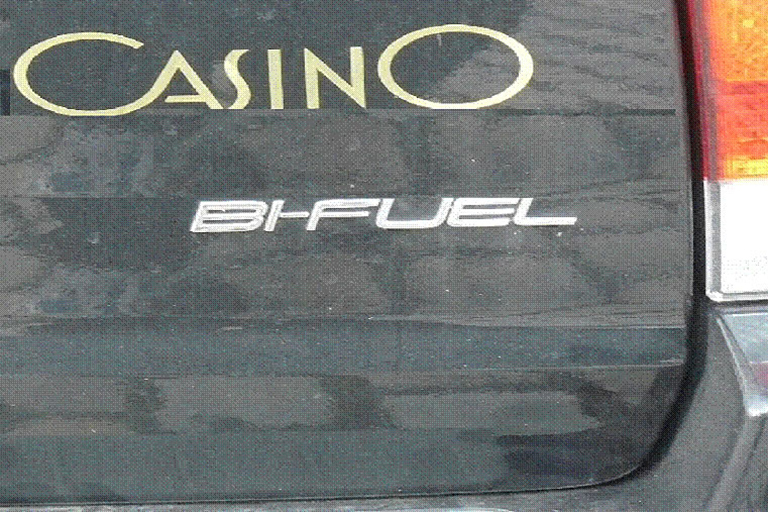 Label on back of vehicle reads “bi-fuel.”